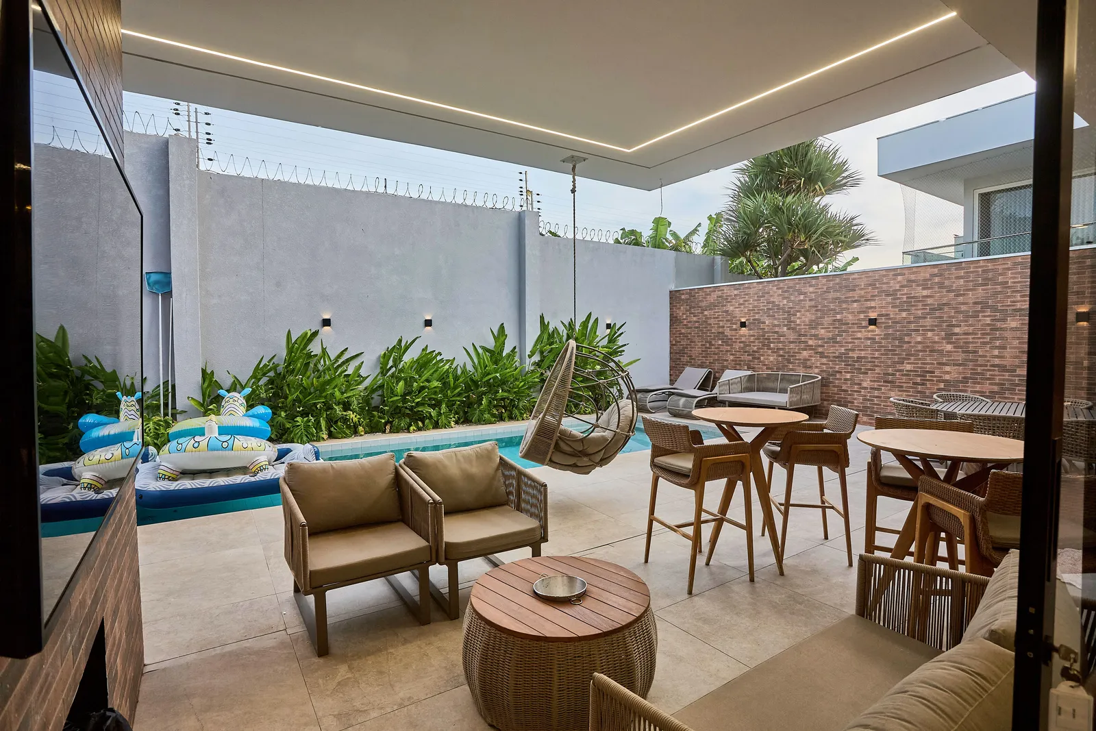 Modern covered patio with wood and woven seating